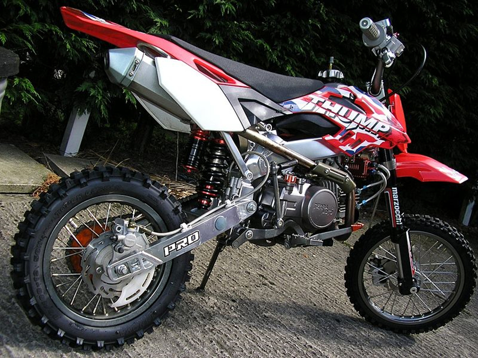A pit bike parked on the street